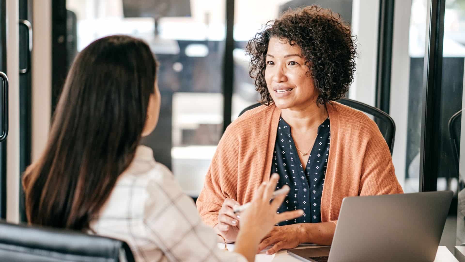 Teacher candidate practicing interview answers with an interviewer